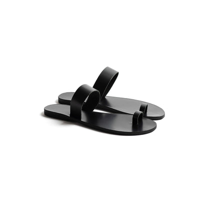 Side view of Astara ladies black flats against a white background.