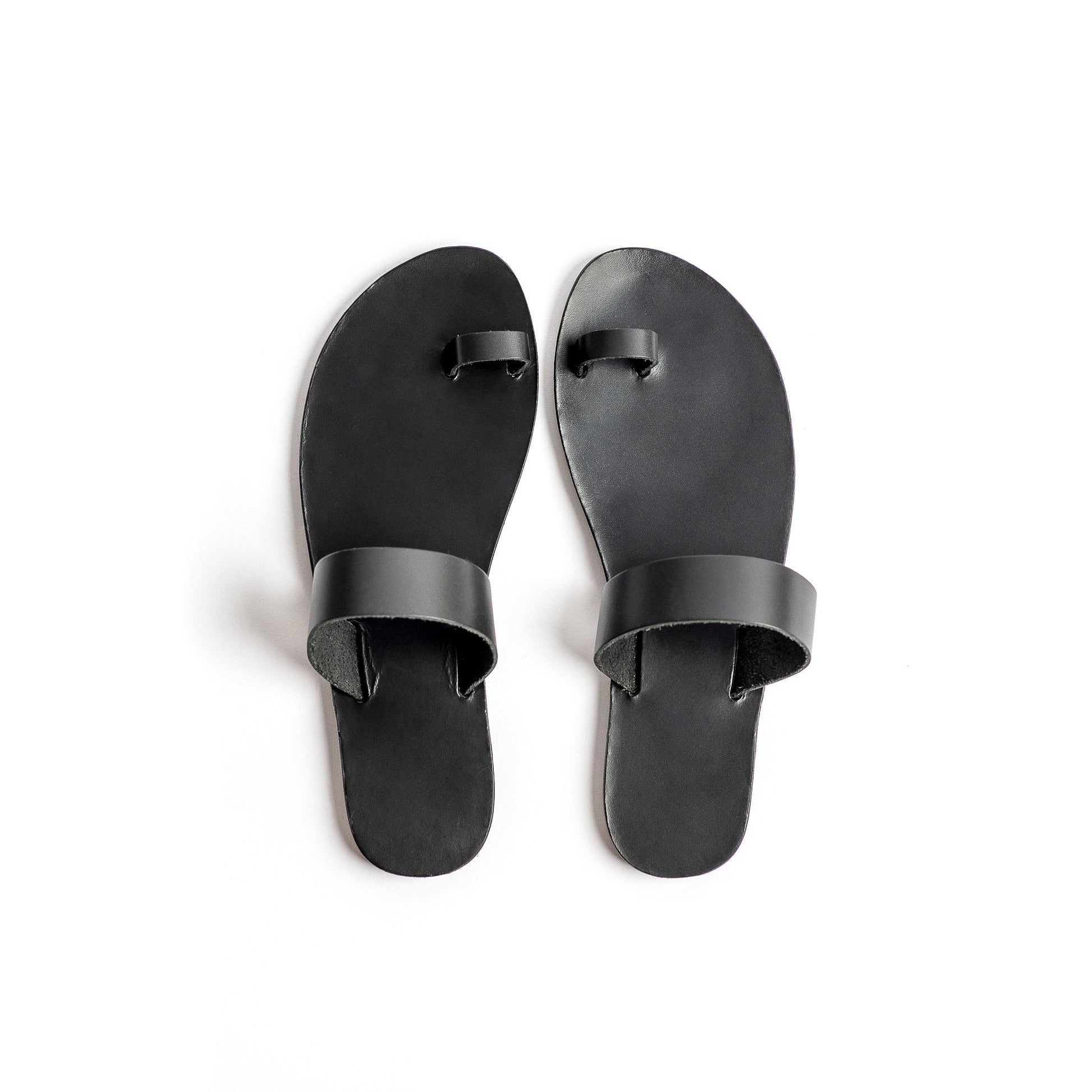 Top view of Astara ladies black flats against a white background.