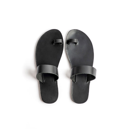 Top view of Astara ladies black flats against a white background.