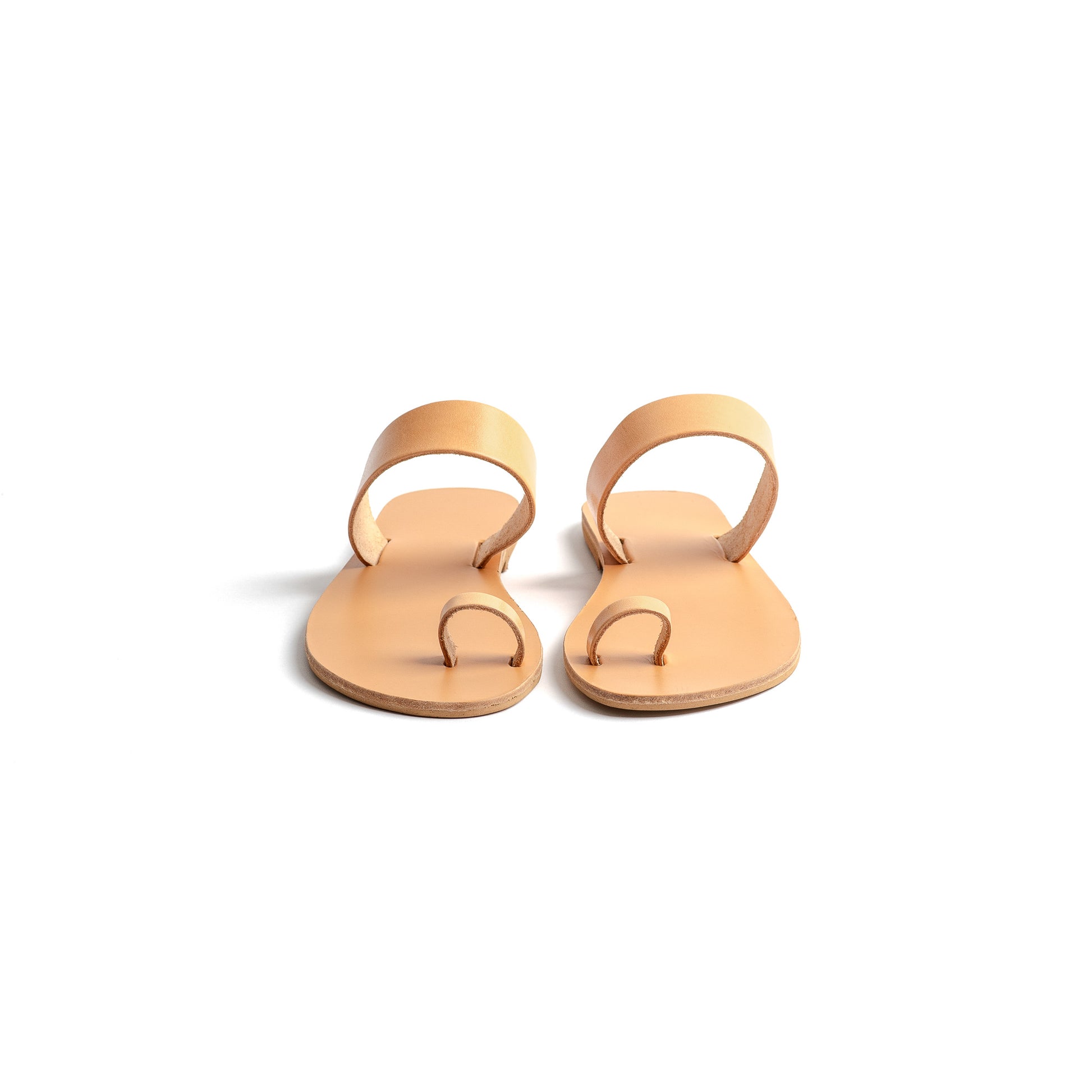Front view of elegant flat sandals in camel against a white background. Part of our flat footwear for womens collection.