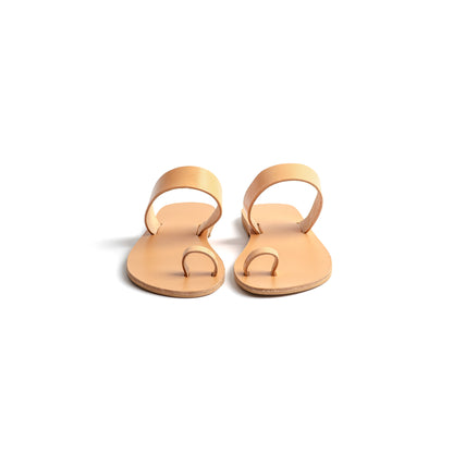 Front view of elegant flat sandals in camel against a white background. Part of our flat footwear for womens collection.