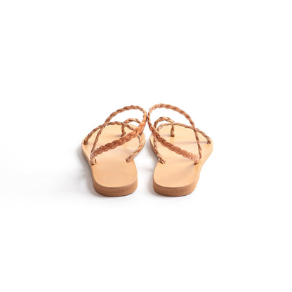 Back view of a pair of tan leather sandals flat for women against a white background. They are flat sandals with back strap. These flat sandals tan are the perfect flat sandals to wear with dresses.