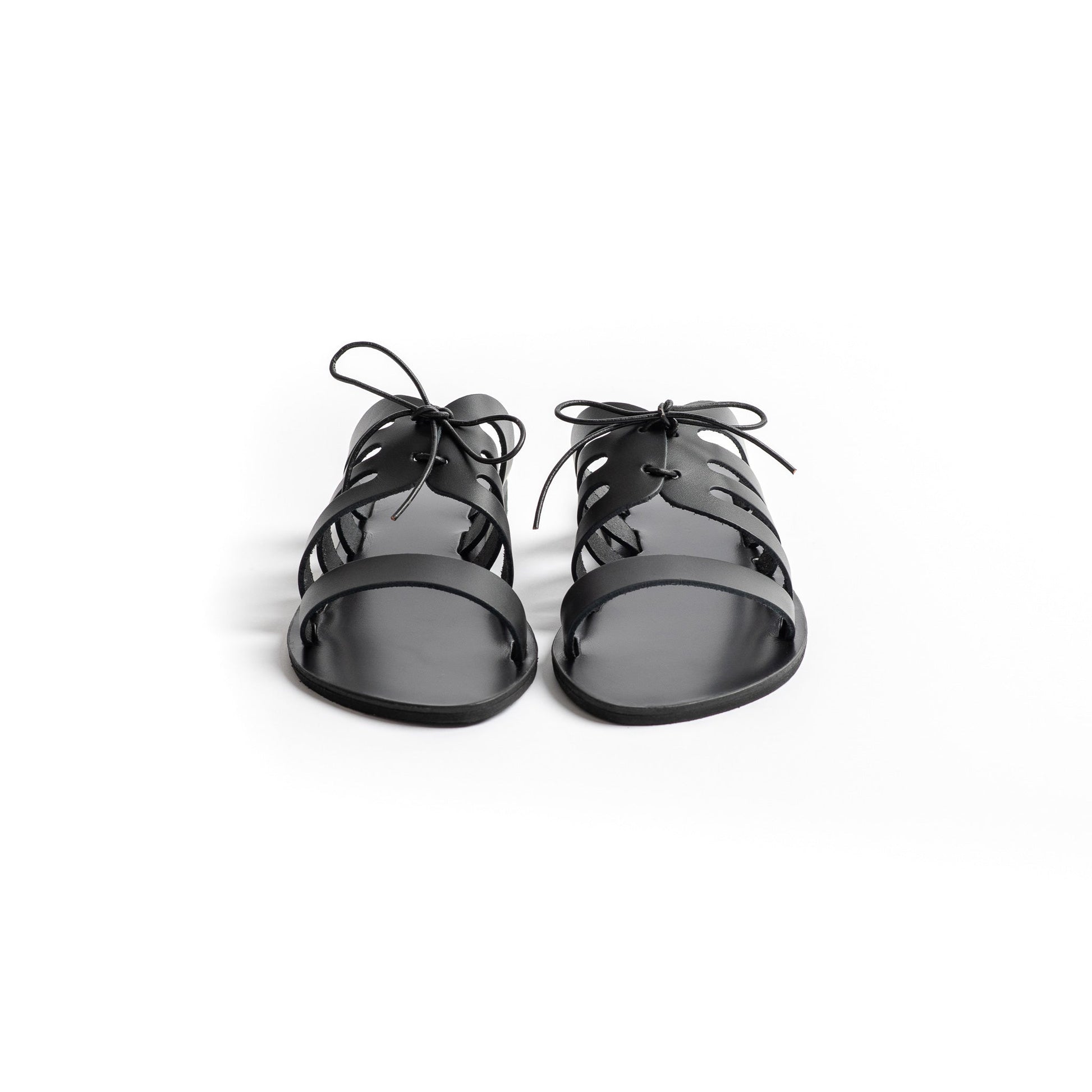 Chloe black flats with bow shot from the front against a white background. These are flat slippers for womens / flat slippers for ladies.