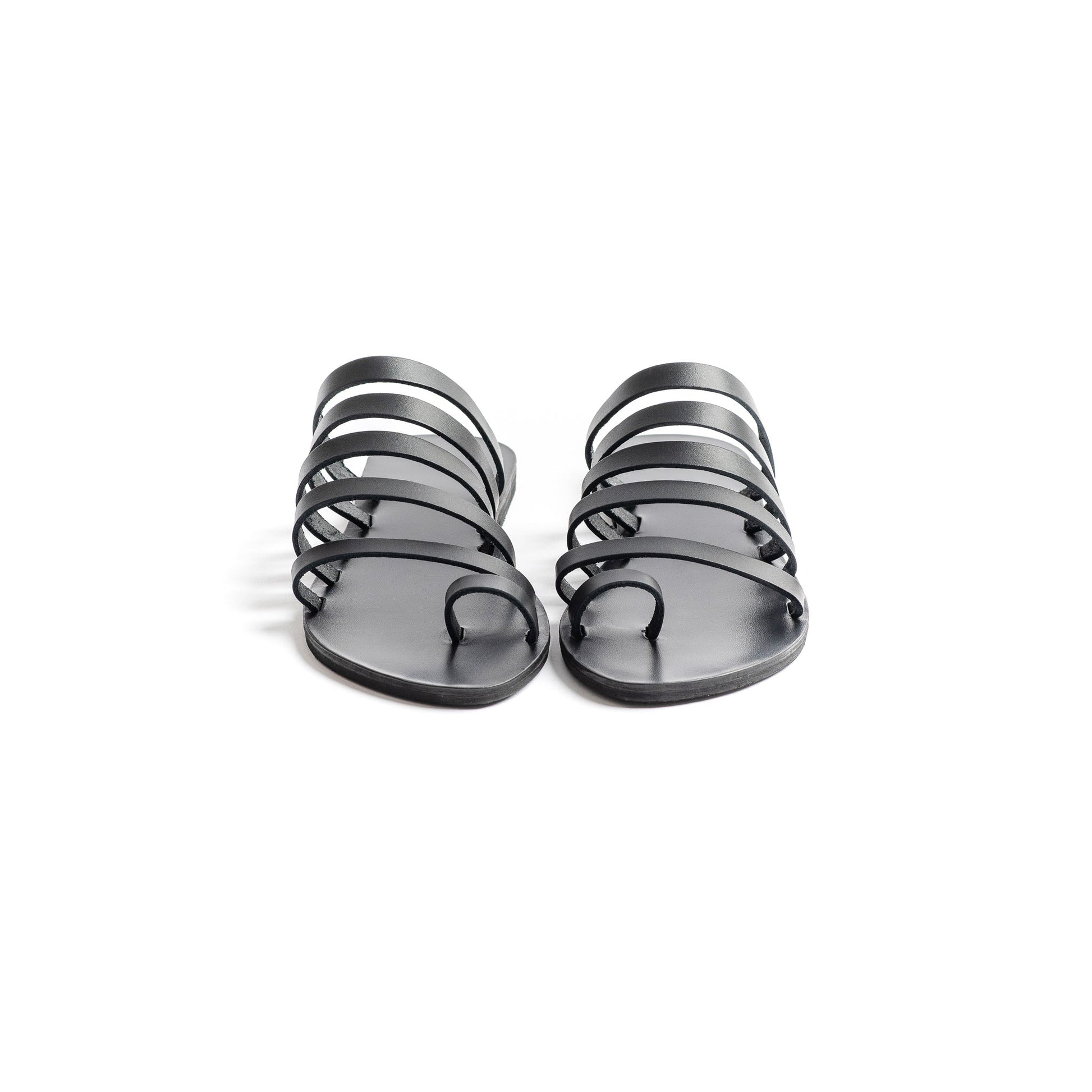 Front view of Harmonia womens leather flats against a white background. They are step in sandals flat.