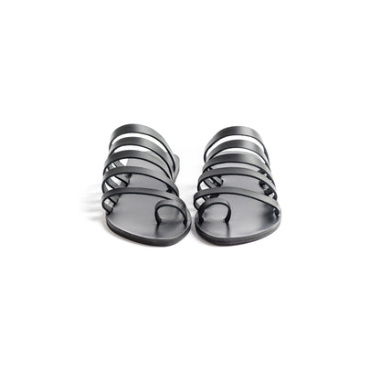Front view of Harmonia womens leather flats against a white background. They are step in sandals flat.